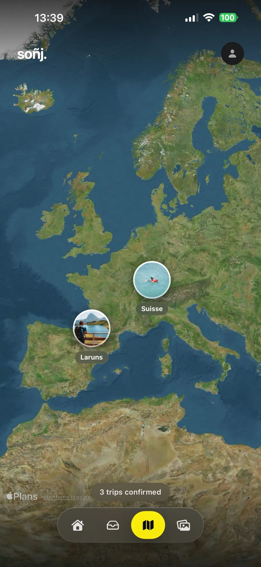 The Soñj globe showing three confirmed trips placed over Europe, Laruns and Switzerland each illustrated by a photo in a round pin